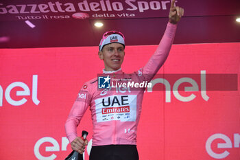 2024-05-05 - Tadej Pogacar wears the Maglia Rosa after San Francesco Al Campo (TO)-Santuario di Oropa (BI) - Stage 2 of Giro D'Italia 2024 - STAGE 2 - S.FRANCESCO AL CAMPO-SANTUARIO DI OROPA - GIRO D'ITALIA - CYCLING