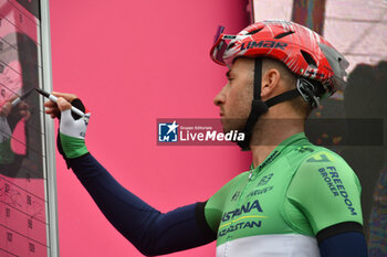 07/05/2024 - Astana Qazaqstan Team on the signature podium Tappa 4 - Acqui Terme-Andora - Giro d'Italia 2024 - STAGE 4 - AQUI TERME-ANDORA - GIRO D'ITALIA - CICLISMO
