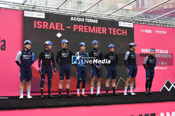 07/05/2024 - Israel Premier Tech on the signature podium Tappa 4 - Acqui Terme-Andora - Giro d'Italia 2024 - STAGE 4 - AQUI TERME-ANDORA - GIRO D'ITALIA - CICLISMO