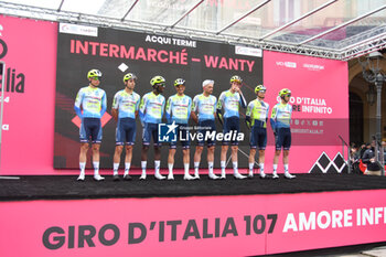 07/05/2024 - Intermarche Wanty on the signature podium Tappa 4 - Acqui Terme-Andora - Giro d'Italia 2024 - STAGE 4 - AQUI TERME-ANDORA - GIRO D'ITALIA - CICLISMO