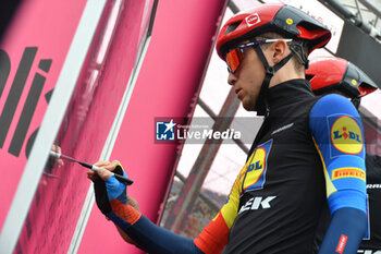 2024-05-07 - Jonathan Milan of Lidl Trek on the signature podium Tappa 4 - Acqui Terme-Andora - Giro d'Italia 2024 - STAGE 4 - AQUI TERME-ANDORA - GIRO D'ITALIA - CYCLING