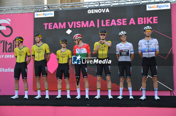 08/05/2024 - Team presentation on signature podium Tappa 5 - Genova-Lucce - Giro d'Italia 2024 - STAGE 5 - GENOVA-LUCCA - GIRO D'ITALIA - CICLISMO