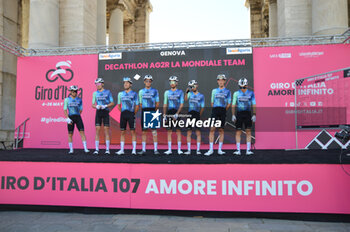 08/05/2024 - Team presentation on signature podium Tappa 5 - Genova-Lucce - Giro d'Italia 2024 - STAGE 5 - GENOVA-LUCCA - GIRO D'ITALIA - CICLISMO