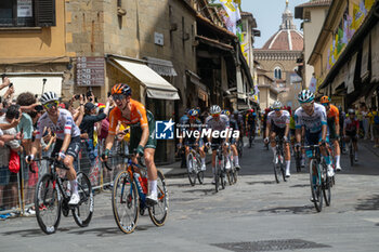 2024-06-29 - The pack of riders cycles on Ponte Vecchio - STAGE 1 - START - TOUR DE FRANCE - CYCLING