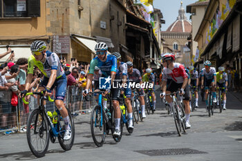 2024-06-29 - The pack of riders cycles on Ponte Vecchio - STAGE 1 - START - TOUR DE FRANCE - CYCLING