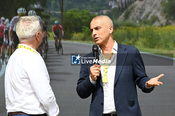 2024-06-29 - the mayor of Rimini Jamil Sadegholvaad intervew on the podium of the tour de France 2024 during first stage - STAGE 1 - FINISH - TOUR DE FRANCE - CYCLING