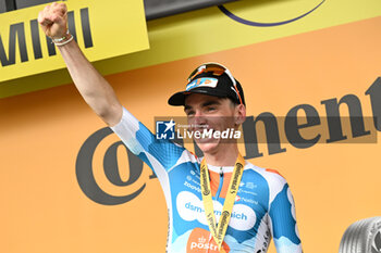 2024-06-29 - ROMAIN BARDET celebrating ON THE PODIUM the WIN THE FIRST STAGE OF THE TOUR DE FRANCE 2024 IN RIMINI - STAGE 1 - FINISH - TOUR DE FRANCE - CYCLING