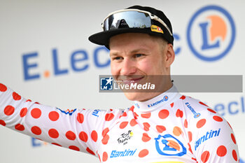 2024-06-29 - JONAS ABRAHAMSEN CELEBRATING PORTRAIT ON THE PODIUM OF THE FIRST STAGE OF THE TOUR DE FRANCE 2024 IN RIMINI WITH THE GRIMPEUR JERSEY - STAGE 1 - FINISH - TOUR DE FRANCE - CYCLING