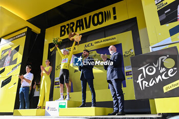 2024-06-30 - Tadej Pogacar (Team UAE Emirates) celebrating the yellow jersey on the podium the second stage of the Tour De France 2024 in Bologna - STAGE 2 - FINISH - TOUR DE FRANCE - CYCLING