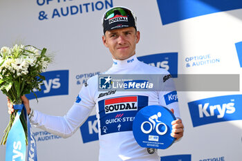 2024-06-30 - Remco Evenepoel celebrating white jersey on the podium of the second stage of the Tour de France 2024 in Bologna (italy) - STAGE 2 - FINISH - TOUR DE FRANCE - CYCLING