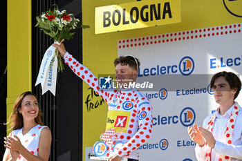 2024-06-30 - JONAS ABRAHAMSEN celebrating the grimpeur jersey after the second stage of the tour de france 2024 - STAGE 2 - FINISH - TOUR DE FRANCE - CYCLING