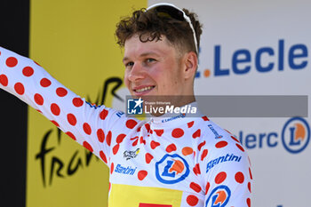 2024-06-30 - JONAS ABRAHAMSEN celebrating the grimpeur jersey after the second stage of the tour de france 2024 - STAGE 2 - FINISH - TOUR DE FRANCE - CYCLING