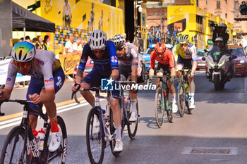 2024-06-30 - Finish line Stage 2 - city circuit turn 1 - chasing cyclists - STAGE 2 - FINISH - TOUR DE FRANCE - CYCLING