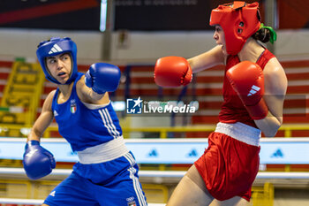 2024-03-06 - Solis Guadalupe (Mex) in red and Mesiano Alessia (Ita) in blue during the Boxing Road to Paris 1st World Qualification Tournament, at E-Work Arena, Busto Arsizio, Italy on March 6, 2024 - BOXING ROAD TO PARIS - BOXING - CONTACT