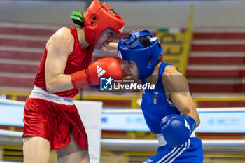 06/03/2024 - Solis Guadalupe (Mex) in red and Mesiano Alessia (Ita) in blue during the Boxing Road to Paris 1st World Qualification Tournament, at E-Work Arena, Busto Arsizio, Italy on March 6, 2024 - BOXING ROAD TO PARIS - BOXE - CONTATTO