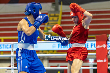 2024-03-06 - Solis Guadalupe (Mex) in red and Mesiano Alessia (Ita) in blue during the Boxing Road to Paris 1st World Qualification Tournament, at E-Work Arena, Busto Arsizio, Italy on March 6, 2024 - BOXING ROAD TO PARIS - BOXING - CONTACT