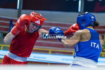 06/03/2024 - Solis Guadalupe (Mex) in red and Mesiano Alessia (Ita) in blue during the Boxing Road to Paris 1st World Qualification Tournament, at E-Work Arena, Busto Arsizio, Italy on March 6, 2024 - BOXING ROAD TO PARIS - BOXE - CONTATTO