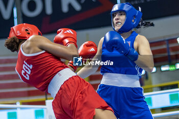 2024-03-06 - Camilo Bravo Camila Gabriela (Col) in red and Carini Angela (Ita) in blue during the Boxing Road to Paris 1st World Qualification Tournament, at E-Work Arena, Busto Arsizio, Italy on March 6, 2024 - BOXING ROAD TO PARIS - BOXING - CONTACT