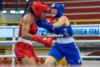 06/03/2024 - Camilo Bravo Camila Gabriela (Col) in red and Carini Angela (Ita) in blue during the Boxing Road to Paris 1st World Qualification Tournament, at E-Work Arena, Busto Arsizio, Italy on March 6, 2024 - BOXING ROAD TO PARIS - BOXE - CONTATTO