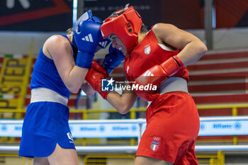 2024-03-06 - Gemini Melissa (Ita) in red and Wojcik Elzbieta (Pol) in blue during the Boxing Road to Paris 1st World Qualification Tournament, at E-Work Arena, Busto Arsizio, Italy on March 6, 2024 - BOXING ROAD TO PARIS - BOXING - CONTACT