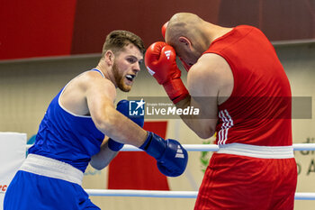 06/03/2024 - Acik Yusuf (Tur) inj red and McDonagh Martin (Irl) in blue during the Boxing Road to Paris 1st World Qualification Tournament, at E-Work Arena, Busto Arsizio, Italy on March 6, 2024 - BOXING ROAD TO PARIS - BOXE - CONTATTO