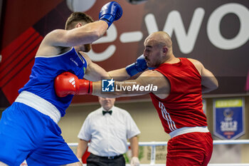 2024-03-06 - Acik Yusuf (Tur) inj red and McDonagh Martin (Irl) in blue during the Boxing Road to Paris 1st World Qualification Tournament, at E-Work Arena, Busto Arsizio, Italy on March 6, 2024 - BOXING ROAD TO PARIS - BOXING - CONTACT