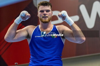 2024-03-06 - McDonagh Martin (Irl) in blue during the Boxing Road to Paris 1st World Qualification Tournament, at E-Work Arena, Busto Arsizio, Italy on March 6, 2024 - BOXING ROAD TO PARIS - BOXING - CONTACT