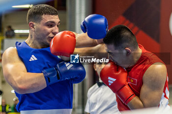 06/03/2024 - Toktosun Uulu Bakyt (Kgz) in red and Lenzi Diego (Ita) in blue during the Boxing Road to Paris 1st World Qualification Tournament, at E-Work Arena, Busto Arsizio, Italy on March 6, 2024 - BOXING ROAD TO PARIS - BOXE - CONTATTO