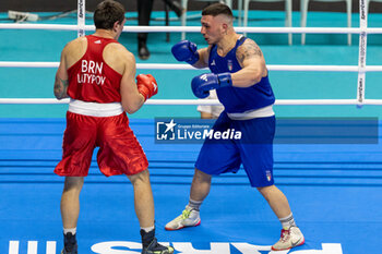 2024-03-11 - Latypov Danis (Brn) in red and Lenzi Diego (Ita) in blue during the Boxing Road to Paris 1st World Qualification Tournament, at E-Work Arena, Busto Arsizio, Italy on March 11, 2024 - BOXING ROAD TO PARIS - BOXING - CONTACT