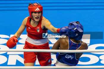 11/03/2024 - Carini Angela (Ita) in red and Moreira Ivanusa (Cpv) in blue during the Boxing Road to Paris 1st World Qualification Tournament, at E-Work Arena, Busto Arsizio, Italy on March 11, 2024 - BOXING ROAD TO PARIS - BOXE - CONTATTO