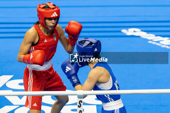 11/03/2024 - Charaabi Sirine (Ita) in red and Im Aeji (Kor) in blue during the Boxing Road to Paris 1st World Qualification Tournament, at E-Work Arena, Busto Arsizio, Italy on March 11, 2024 - BOXING ROAD TO PARIS - BOXE - CONTATTO