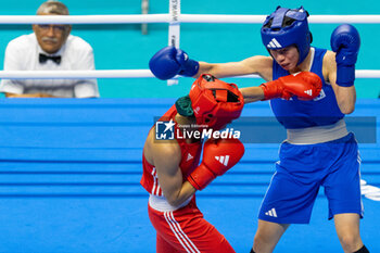 2024-03-11 - Charaabi Sirine (Ita) in red and Im Aeji (Kor) in blue during the Boxing Road to Paris 1st World Qualification Tournament, at E-Work Arena, Busto Arsizio, Italy on March 11, 2024 - BOXING ROAD TO PARIS - BOXING - CONTACT