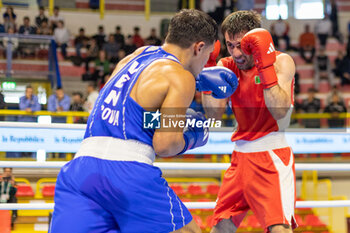 2024-03-11 - Odajev Saparmyrat (Tkm) in red and Cova Jesus (Ven) in blue during the Boxing Road to Paris 1st World Qualification Tournament, at E-Work Arena, Busto Arsizio, Italy on March 11, 2024 - BOXING ROAD TO PARIS - BOXING - CONTACT