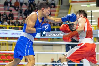 11/03/2024 - Odajev Saparmyrat (Tkm) in red and Cova Jesus (Ven) in blue during the Boxing Road to Paris 1st World Qualification Tournament, at E-Work Arena, Busto Arsizio, Italy on March 11, 2024 - BOXING ROAD TO PARIS - BOXE - CONTATTO