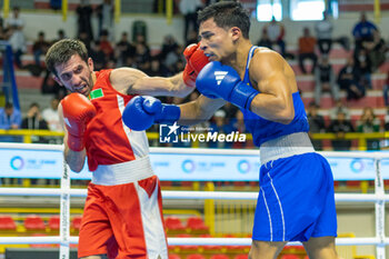 11/03/2024 - Odajev Saparmyrat (Tkm) in red and Cova Jesus (Ven) in blue during the Boxing Road to Paris 1st World Qualification Tournament, at E-Work Arena, Busto Arsizio, Italy on March 11, 2024 - BOXING ROAD TO PARIS - BOXE - CONTATTO