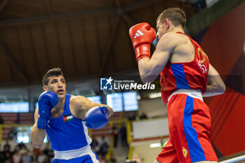 2024-03-11 - Paraschiv Alexandru (Mda) in red and Alkasbeh Obada (Jor) in blue during the Boxing Road to Paris 1st World Qualification Tournament, at E-Work Arena, Busto Arsizio, Italy on March 11, 2024 - BOXING ROAD TO PARIS - BOXING - CONTACT