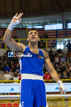 2024-03-11 - Alkasbeh Obada (Jor) in blue during the Boxing Road to Paris 1st World Qualification Tournament, at E-Work Arena, Busto Arsizio, Italy on March 11, 2024 - BOXING ROAD TO PARIS - BOXING - CONTACT