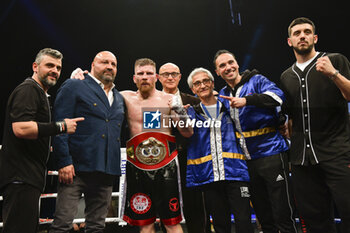 2024-04-19 - Giuseppe Claudio Squeo (ITA) with his team after the victorius match against Nikas Rasanen (FIN)valid for the Cruiserweight IBF European champion on April 19, 2022 at PalaStudio Cinecitta World in Rome, Italy - IBF CRUISER EUROPEAN TITLE - SQUEO VS RASANEN - BOXING - CONTACT