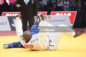 2024-02-04 - Teddy Riner of France (white) celebrates winning against Minjong Kim of South Korea (blue) during the Men's +100kg Final of the Paris Grand Slam 2024, an IJF Judo event on February 4, 2024 at Accor Arena in Paris, France - JUDO - PARIS GRAND SLAM 2024 - JUDO - CONTACT