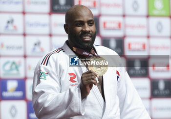 2024-02-04 - Teddy Riner of France (white) celebrates during the podium ceremony after winning against Minjong Kim of South Korea (blue) the Men's +100kg Final of the Paris Grand Slam 2024, an IJF Judo event on February 4, 2024 at Accor Arena in Paris, France - JUDO - PARIS GRAND SLAM 2024 - JUDO - CONTACT