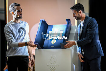 2024-02-08 - President of the Paris 2024 Organising Committee for the Olympic and Paralympic Games and former French canoeist Tony ESTANGUET and French retired biathlete Martin FOURCADE pose next to Olympic medals during the unveiling of the medals for the Paris 2024 Olympic and Paralympic games on February 8, 2024 in Saint-Denis, France - OLYMPIC GAMES PARIS 2024 - UNVEILING OF OLYMPIC AND PARALYMPIC MEDALS - OLYMPIC GAMES PARIS 2024 - OLYMPIC GAMES