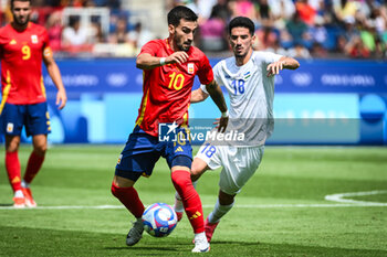 2024-07-24 - BAENA Alex of Spain and BURIEV Abdurauf of Uzbekistan during the football match between Uzbekistan and Spain, Olympic Games Paris 2024 on 24 July 2024 at Parc des Princes stadium in Paris, France - OLYMPIC GAMES PARIS 2024 - 24/07 - OLYMPIC GAMES PARIS 2024 - OLYMPIC GAMES