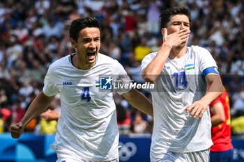 2024-07-24 - SHOMURODOV Eldor of Uzbekistan celebrate his goal with ALIKULOV Khusniddin of Uzbekistan during the football match between Uzbekistan and Spain, Olympic Games Paris 2024 on 24 July 2024 at Parc des Princes stadium in Paris, France - OLYMPIC GAMES PARIS 2024 - 24/07 - OLYMPIC GAMES PARIS 2024 - OLYMPIC GAMES