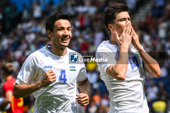 2024-07-24 - SHOMURODOV Eldor of Uzbekistan celebrate his goal with ALIKULOV Khusniddin of Uzbekistan during the football match between Uzbekistan and Spain, Olympic Games Paris 2024 on 24 July 2024 at Parc des Princes stadium in Paris, France - OLYMPIC GAMES PARIS 2024 - 24/07 - OLYMPIC GAMES PARIS 2024 - OLYMPIC GAMES