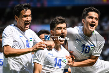 2024-07-24 - SHOMURODOV Eldor of Uzbekistan celebrate his goal with ALIKULOV Khusniddin of Uzbekistan and JALOLIDDINOV Jasurbek of Uzbekistan during the football match between Uzbekistan and Spain, Olympic Games Paris 2024 on 24 July 2024 at Parc des Princes stadium in Paris, France - OLYMPIC GAMES PARIS 2024 - 24/07 - OLYMPIC GAMES PARIS 2024 - OLYMPIC GAMES