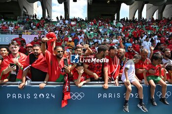 2024-07-24 - Fans of Morocco during the Football, Men's Group B, between Argentina and Morocco during the Olympic Games Paris 2024 on 24 July 2024 at Geoffroy-Guichard Stadium in Saint-Etienne, France - OLYMPIC GAMES PARIS 2024 - 24/07 - OLYMPIC GAMES PARIS 2024 - OLYMPIC GAMES