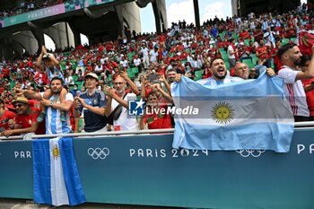 2024-07-24 - Fans of Argentina during the Football, Men's Group B, between Argentina and Morocco during the Olympic Games Paris 2024 on 24 July 2024 at Geoffroy-Guichard Stadium in Saint-Etienne, France - OLYMPIC GAMES PARIS 2024 - 24/07 - OLYMPIC GAMES PARIS 2024 - OLYMPIC GAMES