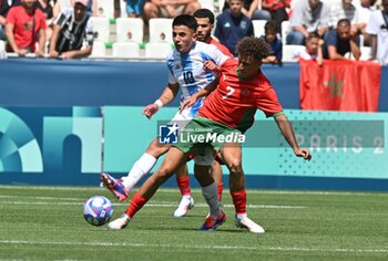 2024-07-24 - Thiago Almada of Argentina and Eliesse Ben Seghir of Morocco during the Football, Men's Group B, between Argentina and Morocco during the Olympic Games Paris 2024 on 24 July 2024 at Geoffroy-Guichard Stadium in Saint-Etienne, France - OLYMPIC GAMES PARIS 2024 - 24/07 - OLYMPIC GAMES PARIS 2024 - OLYMPIC GAMES