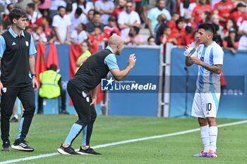 2024-07-24 - Javier Mascherano and Thiago Almada of Argentina during the Football, Men's Group B, between Argentina and Morocco during the Olympic Games Paris 2024 on 24 July 2024 at Geoffroy-Guichard Stadium in Saint-Etienne, France - OLYMPIC GAMES PARIS 2024 - 24/07 - OLYMPIC GAMES PARIS 2024 - OLYMPIC GAMES