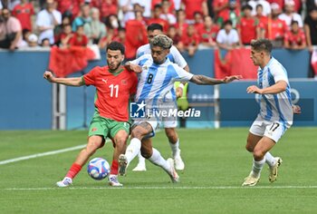 2024-07-24 - Zakaria El Ouadi of Morocco and Cristian Medina of Argentina during the Football, Men's Group B, between Argentina and Morocco during the Olympic Games Paris 2024 on 24 July 2024 at Geoffroy-Guichard Stadium in Saint-Etienne, France - OLYMPIC GAMES PARIS 2024 - 24/07 - OLYMPIC GAMES PARIS 2024 - OLYMPIC GAMES